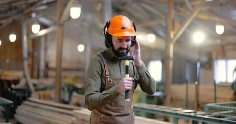 Carpentry worker having fun at the factory Stock Footage 146921854