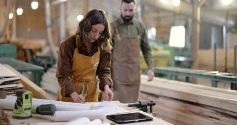 Carpentry workers designing at the joinery Stock Footage 146909518