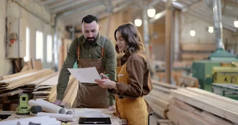 Carpentry workers designing at the joinery Stock Footage 146910444