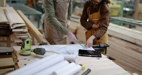 Carpentry workers designing at the joinery Stock Footage 146913554