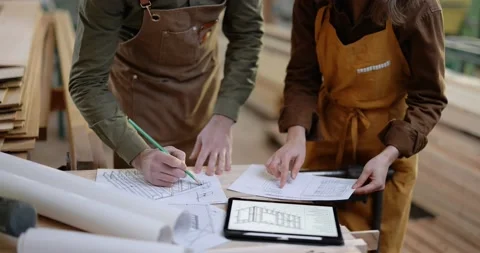 Carpentry workers designing some woodwork Stock Footage 146912496