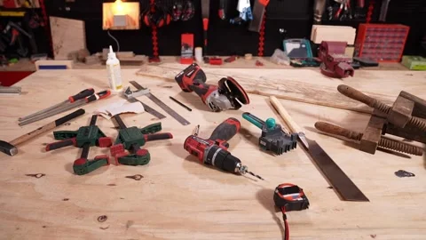 Carpentry Workshop Bench with Hand Tools and Cordless Power Tools Stock Footage 346204475
