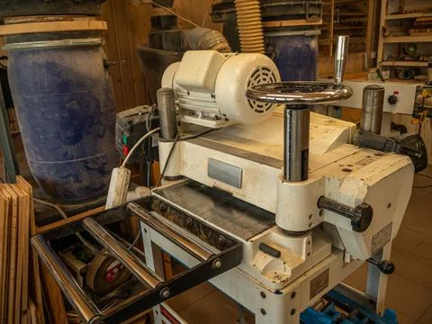 Carpentry workshop. Close-up of an electric planer machine. Stock Photos