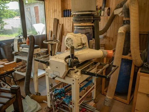 Carpentry workshop. Joiner's machines. A machine for sanding the surface of w Stock-Fotos
