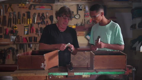 Carpentry Workshop of Master Carpenter and Apprentice Measuring Wood with R.. Stock Footage 247306840