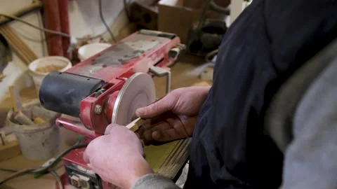 Carpentry workshop, master craftsman working. Operates a woodworking sanding Stock Footage 278963925