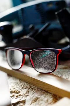 Carpentry workshop. Sawdust on eyeglasses Stock Photos