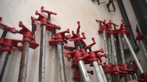 Carpentry workshop with tools, instruments and equipments, steel wood clamps Stock Footage 211604306