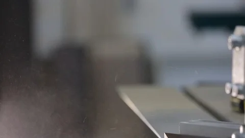 Carpentry workshop, woodworking machine moves, wood dust flies out under the saw Stock Footage 124924281