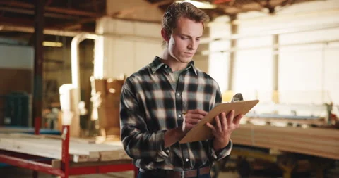 Carpentry, writing and man in workshop with clipboard, inspection and material Stock Footage 341305036