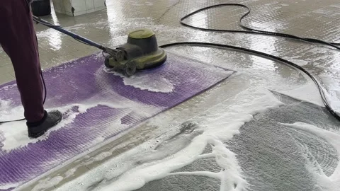 Carpet cleaning using a special vacuum that creates a large amount of foam. Stock Footage 237810497
