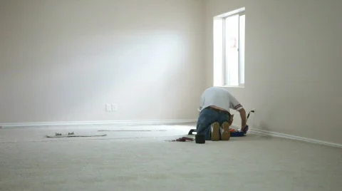 Carpet layer joining seam in new home construction P HD 0240 Stock Footage 451612