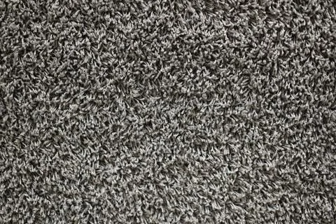 The carpet random pattern rug yarn dark black and white background. Stock Photos