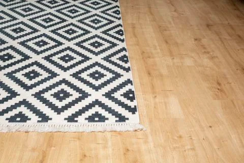 Carpet standing on the floor Stock Photos