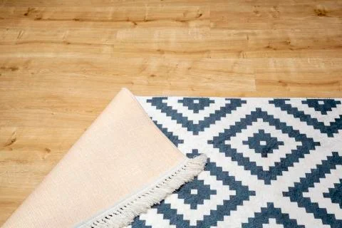 Carpet standing on the floor Stock Photos