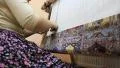 Carpet weaving. Turk woman make a silk carpet HD Footage