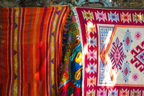 Carpets embroidered from threads of various bright colors Stock Photos