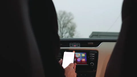 CarPlay Dashboard with Apple TV on iPhone 14 Pro Stock Footage 276603315