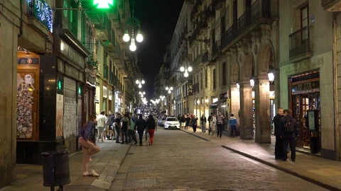 Carrer de Ferran, Barcelona, Spain - May 9, 2018: people walk on a night street Stock Footage 90021908