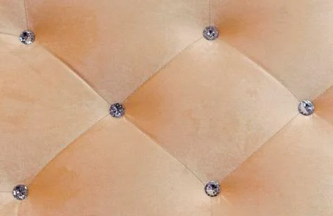 Carriage coupler. Panel of beige fabric with crystals. Stock Photos