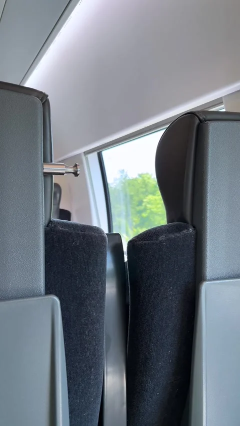 Carriage empty interior of modern high speed passenger train with seats Stock Footage 332561074