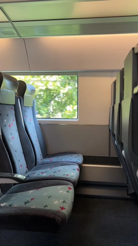 Carriage interior of modern high speed passenger train with empty seats Stock Footage 280484913