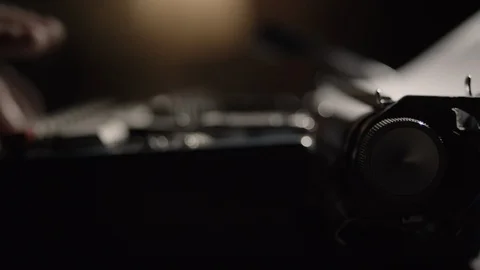 Carriage return knob pushing into focus while typing on a vintage typewriter Stock Footage 97855832