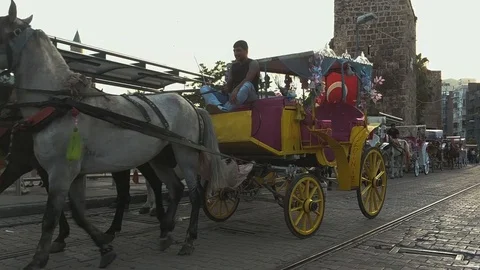 Carriages with horses on the streets of the old center of Antalya Stock Footage
