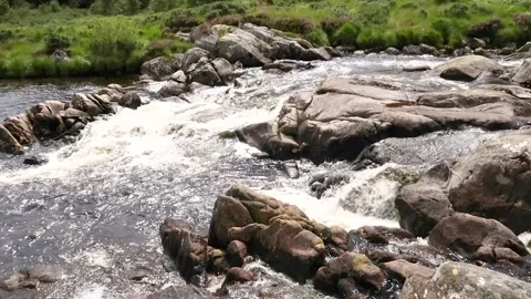 Carrick Lane River flowing over granite rocks, Ayrshire, Scotland Stock Footage 202345342