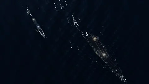 Carrier flight deck lit for night operations aerial night flight ops open wa Stock-Footage 343735049