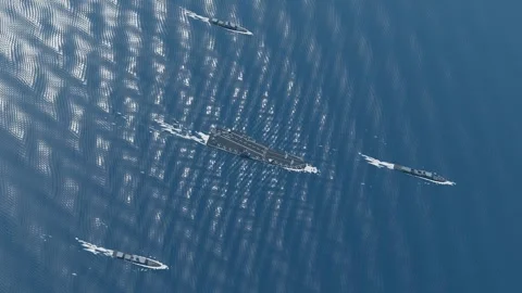 Carrier strike group diamond screen formation aerial deep blue ocean loop Video stock 343736106