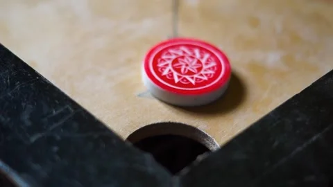 Carrom Board Playing hitting Red Queen with Striker and gets into pocket socket Video stock 197806085