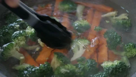 Carrot and broccoli was boiled in water in the pan. Healthy boil vegetable 스톡 동영상 201549344