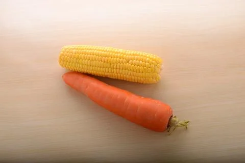 Carrot and corn on kitchen table Fotos Stock