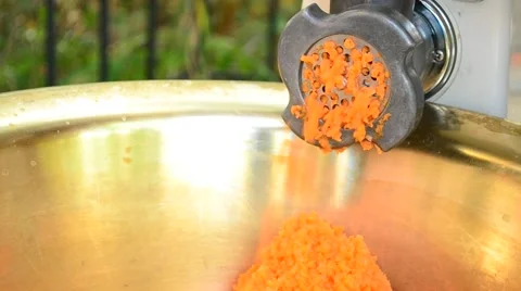Carrot being chopped into tiny pieces with a mincer Stock Footage 58197230