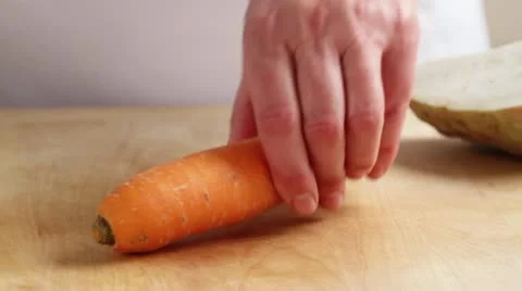A carrot being peeled Stock Footage 24663807