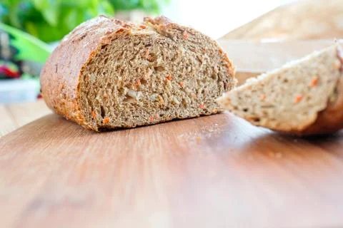 Carrot bread. Side view, visible knife. Home baked without yeast Stock Photos