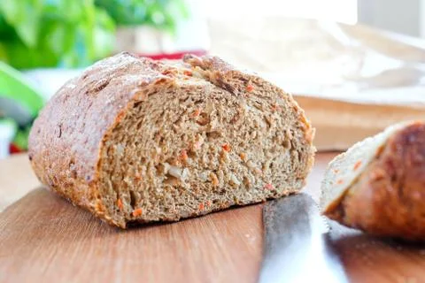 Carrot bread without yeast. Side view, visible knife Stock Photos