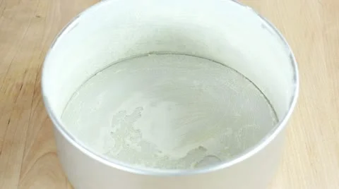 Carrot cake mixture being poured into a prepared baking tin Stock Footage 24671653