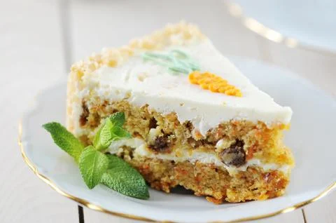Carrot cake slice with mint Stock Photos