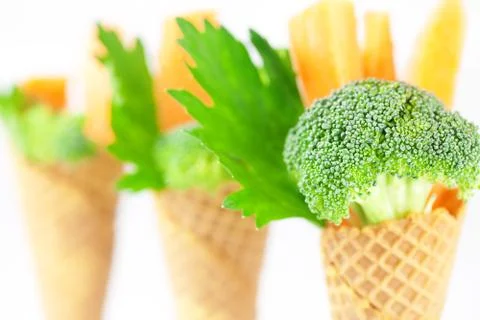 Carrot, celery, broccoli in a waffle cone isolated on white Foto stock