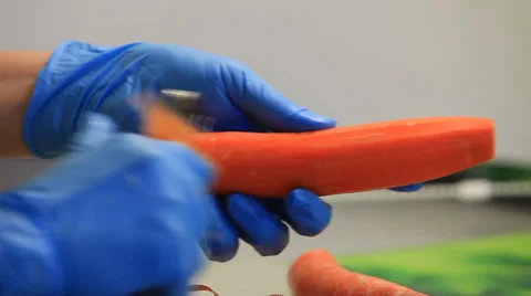Carrot cleaning kitchen knife Stock Footage 35753547