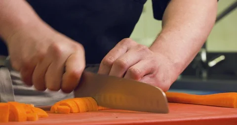 Carrot cut with knife Stock-Footage 89395218