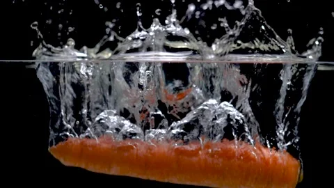 Carrot Falling in Water Video stock 135492503