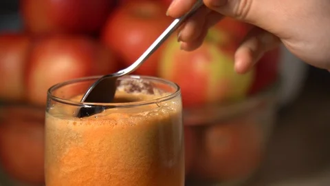 Carrot foam testing with a tea spoon Stock Footage 128517470