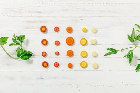 Carrot gradient with greens Stock Photos