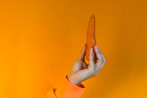 Carrot in hand Stock Photos