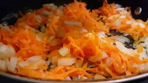 Carrot onion in a frying pan Stock Footage 80500855