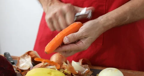 Carrot peeled using vegetable peeler Stock Footage 147510637