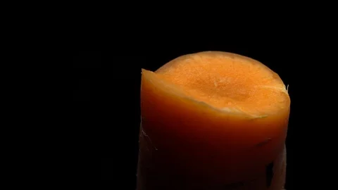 Carrot in rotation on black background. Stock Footage 98763763